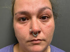 Newport Town woman arrested on warrant and DLS charges, police say