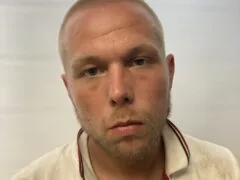 Arlington man arrested on warrant for unlawful trespass, police say